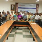 Academics and researchers discussing tribal language preservation at a national seminar hosted by Guwahati University.