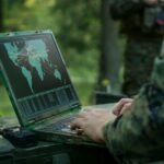 Border security personnel monitoring an international boundary using advanced surveillance systems.