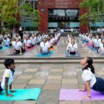 Indian Army Chief General Upendra Dwivedi leading a large group yoga session during the 12th International Yoga Day celebrations in Tezpur, Assam.
