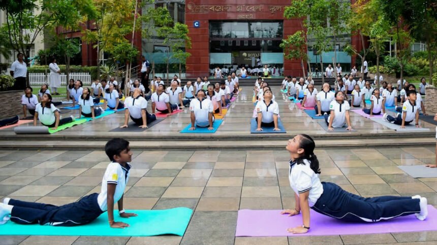 Indian Army Chief General Upendra Dwivedi leading a large group yoga session during the 12th International Yoga Day celebrations in Tezpur, Assam.