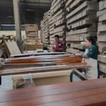 Workers processing bamboo materials in Tripura industrial unit under a government-backed bamboo development initiative.