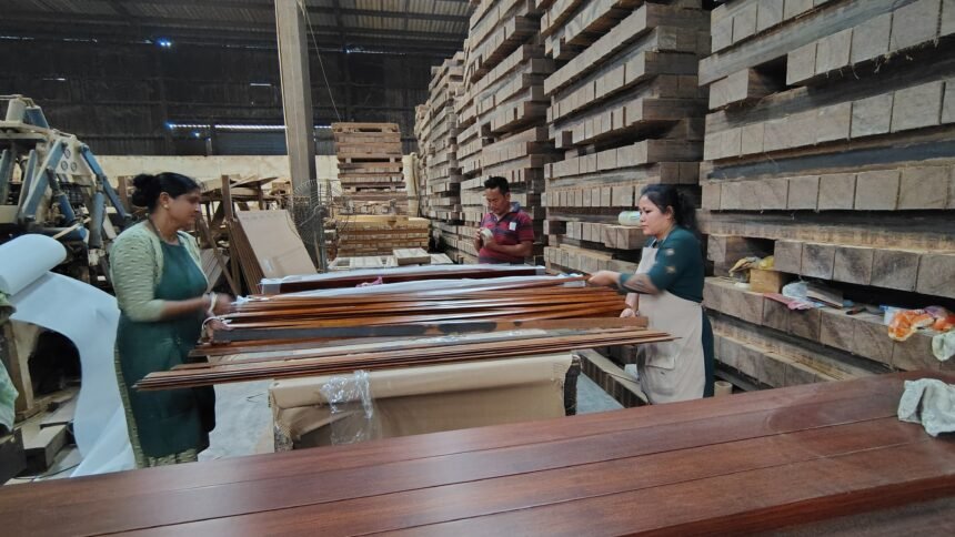 Workers processing bamboo materials in Tripura industrial unit under a government-backed bamboo development initiative.