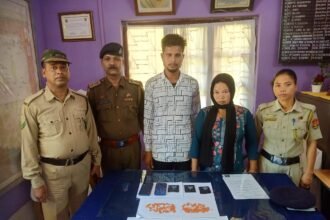 Imphal West Police personnel present individuals arrested during an operation targeting alleged illegal extortion networks affecting local shops.