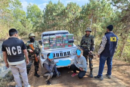 Security personnel display seized narcotics recovered during a coordinated border operation that intercepted a suspected cross-border drug shipment exceeding 200 kilograms.