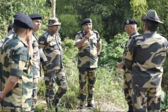 Tripura Police personnel conducting identity verification checks and security inspections near a border area.