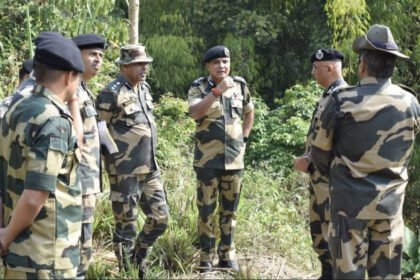 Tripura Police personnel conducting identity verification checks and security inspections near a border area.