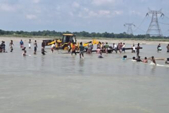 Displaced flood-affected residents stay inside a government-run relief camp in Assam as authorities provide temporary shelter and emergency assistance during the flood crisis.