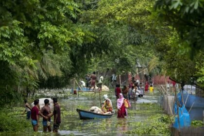 Floodwaters completely submerge villages in Charaideo district as homes, roads, and agricultural fields remain inundated during Assam's ongoing monsoon flood crisis.