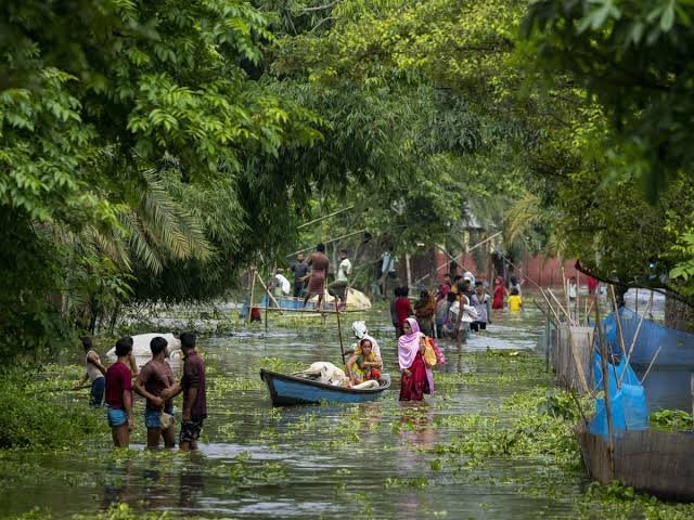 Floodwaters completely submerge villages in Charaideo district as homes, roads, and agricultural fields remain inundated during Assam's ongoing monsoon flood crisis.