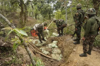 Security personnel conducting search operations in Manipur as part of efforts to recover illegally held weapons.