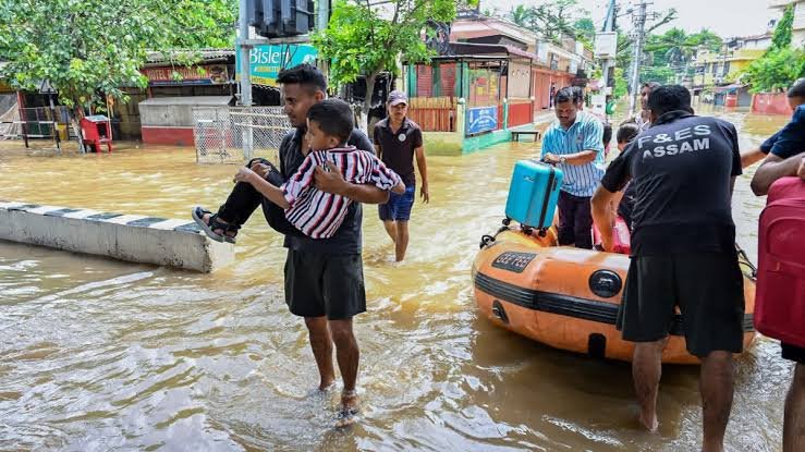 Flood-affected families stay in a government relief camp where officials provide temporary shelter and essential assistance as part of Assam's ongoing flood response.