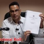 Election officials display the updated Sikkim draft electoral roll for public verification at the Office of the Chief Electoral Officer.