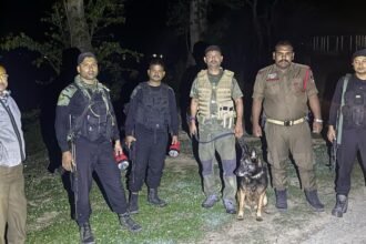 Security personnel secure the area after a reported militant attack on an Assam Rifles convoy near Lungshang Kong village in Manipur's Ukhrul district.