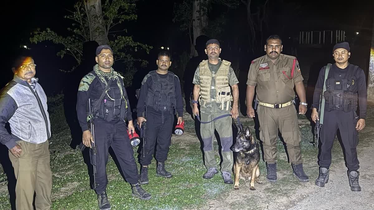 Security personnel secure the area after a reported militant attack on an Assam Rifles convoy near Lungshang Kong village in Manipur's Ukhrul district.