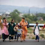 Residents near the Taksing border area point toward the frontier as security agencies monitor reports of unusual movement following an alert from the Nah Welfare Society.