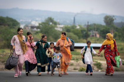 Residents near the Taksing border area point toward the frontier as security agencies monitor reports of unusual movement following an alert from the Nah Welfare Society.