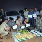 Law enforcement personnel displaying seized narcotics during a counter-drug operation in Mizoram.