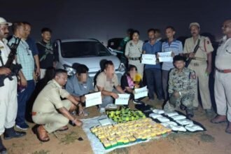 Law enforcement personnel displaying seized narcotics during a counter-drug operation in Mizoram.