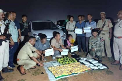 Law enforcement personnel displaying seized narcotics during a counter-drug operation in Mizoram.