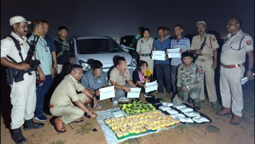 Law enforcement personnel displaying seized narcotics during a counter-drug operation in Mizoram.