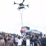 Payload drones deliver food packages over flooded areas of Majuli as part of an emergency relief operation for villages isolated by rising floodwaters.