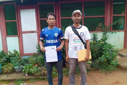 Sports icon Klingson D. Marak receives electoral roll enumeration forms during the official launch of Meghalaya's voter list revision campaign.