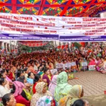 Civil society members participate in a peaceful sit-in protest in Imphal, calling for greater security accountability amid ongoing civilian unrest.