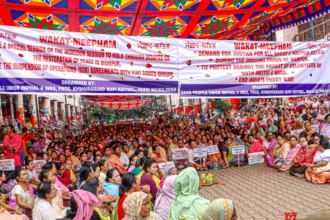 Civil society members participate in a peaceful sit-in protest in Imphal, calling for greater security accountability amid ongoing civilian unrest.