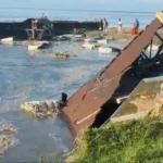 Riverbank erosion damages residential areas in Rohmoria, Dibrugarh, where homes are destroyed due to severe land loss along the river.