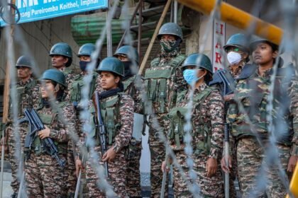 Security personnel and law enforcement agencies conducting coordinated operations and surveillance activities near an international border region in Manipur.