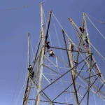 Electricity poles and power lines extend into a remote tribal village in Tripura after successful grid connectivity under a rural electrification programme.