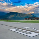 Pakyong Airport runway surrounded by hilly terrain as authorities seek emergency funds for runway slope repair work.