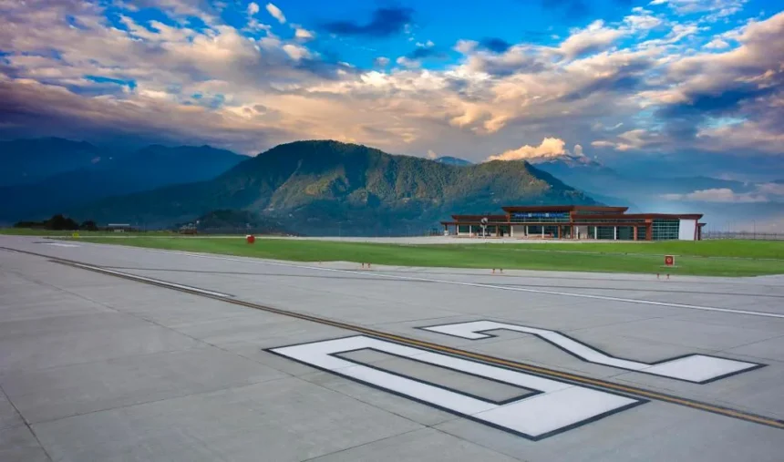 Pakyong Airport runway surrounded by hilly terrain as authorities seek emergency funds for runway slope repair work.