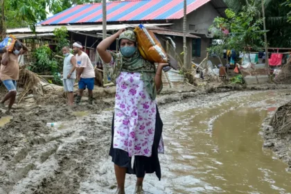 Flood-affected rural communities in Assam face a rising official death toll of 98 amid widespread inundation.