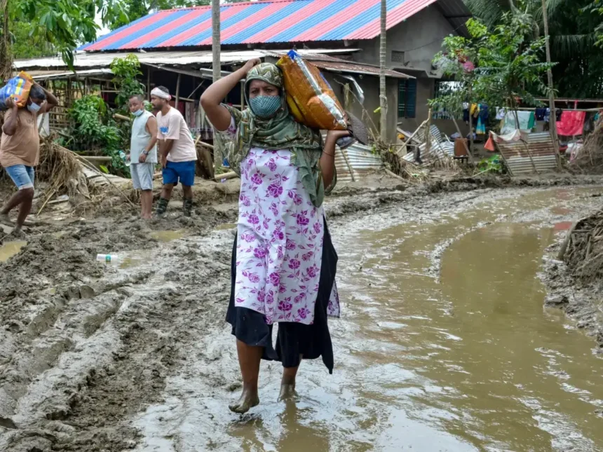 Flood-affected rural communities in Assam face a rising official death toll of 98 amid widespread inundation.