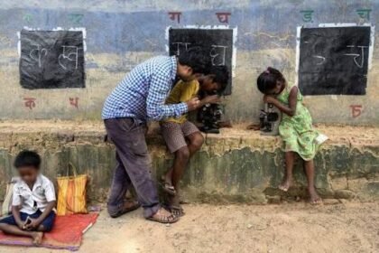 Local teachers conduct makeshift open-air classes on a dry highway divider in flood-affected Najira.