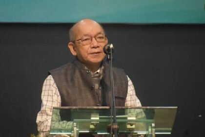 Mizoram Home Minister K. Sapdanga addresses officials during a meeting while discussing the need for a clear Central Government policy on Zo ethnic refugees.