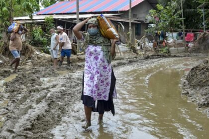 Flood-affected residents in Assam receive emergency support as authorities report 1.55 lakh people impacted across five districts.