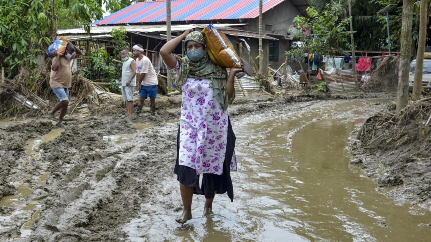 Flood-affected residents in Assam receive emergency support as authorities report 1.55 lakh people impacted across five districts.