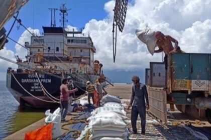 Trucks and goods movement at Dawki land port affected by heavy monsoon rains during India-Bangladesh cross-border trade operations.