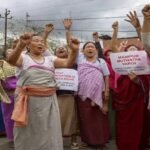 Women-led civil society groups demonstrate outside the Manipur Legislative Assembly while demanding faster government resolutions.