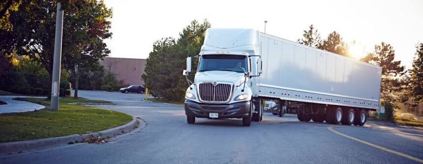 Commercial trucks move smoothly through the Pallel check-point as security personnel manage streamlined freight operations to improve logistics and maintain efficient traffic flow.