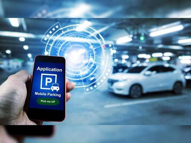 Motorists use a smartphone app to access designated smart parking spaces in downtown Kohima under the municipality's new digital parking management system.