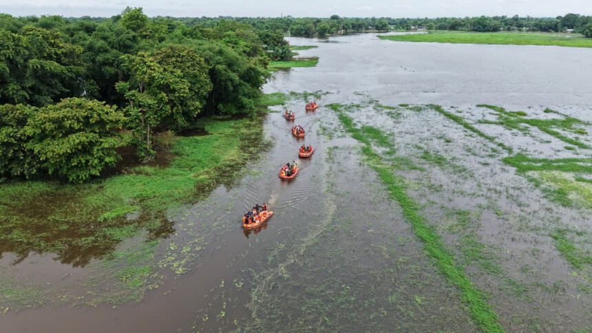 The Dhansiri river near Numaligarh flows under severe flood conditions as authorities monitor rising water levels during the monsoon season.