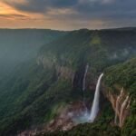 Dense fog and heavy rainfall cover Cherrapunji hills in Sohra as authorities issue a temporary tourist safety advisory during severe monsoon conditions.