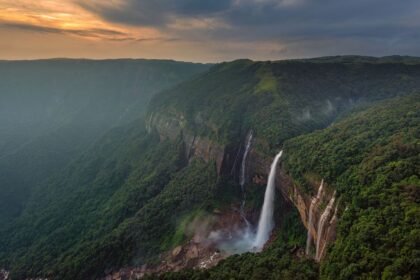 Dense fog and heavy rainfall cover Cherrapunji hills in Sohra as authorities issue a temporary tourist safety advisory during severe monsoon conditions.