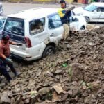 Rain-affected residential areas in Tura after three retaining walls collapse due to soil saturation during heavy monsoon rainfall.