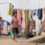 Families residing in a transit camp receive government assistance as part of Manipur's latest financial aid package supporting displaced communities during rehabilitation efforts.