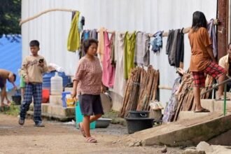 Families residing in a transit camp receive government assistance as part of Manipur's latest financial aid package supporting displaced communities during rehabilitation efforts.