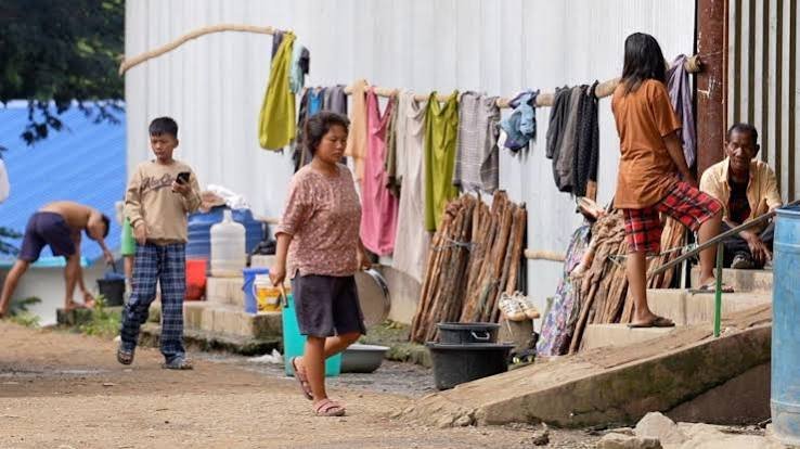 Families residing in a transit camp receive government assistance as part of Manipur's latest financial aid package supporting displaced communities during rehabilitation efforts.